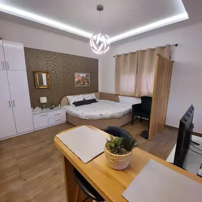 a living room with a bed and a table at Sweet memories 2 in Žarkovo