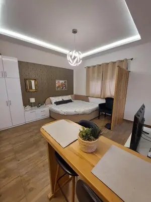 a living room with a bed and a dining room table at Sweet memories 2 in Žarkovo