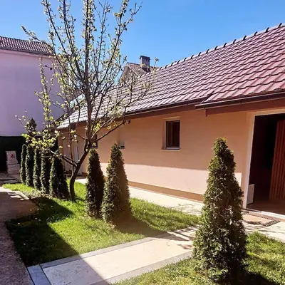 a house with a row of trees in the yard at Sweet memories 2 in Žarkovo