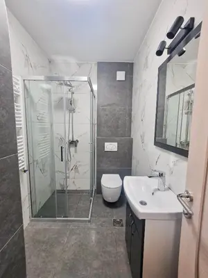 a bathroom with a shower and a toilet and a sink at Andrej Lux in Jajinci