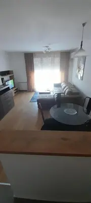 a living room with a couch and a table at Elegance in Zemun