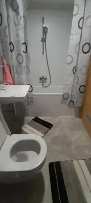 a bathroom with a toilet and a sink at Elegance in Zemun