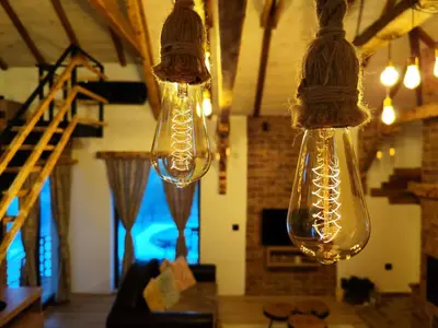 two lights hanging from the ceiling in a room at NaVisu avlija in Kruševica