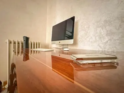 a desk with a tv and a computer on it at Djuras residence in the center of Belgrade in Belgrade