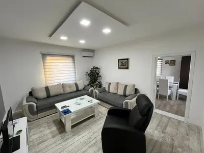 a living room with a couch and a table at Čajića avlija in Obrenovac