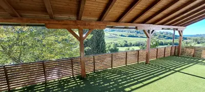 a balcony of a house with a wooden roof at Vila Felicita in Sremski Karlovci