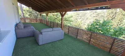 a balcony with two couches on a wooden railing at Vila Felicita in Sremski Karlovci
