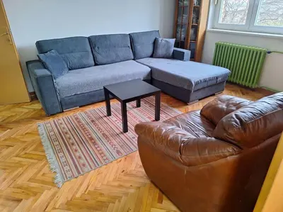 a living room with a leather couch and a coffee table at Apartment Casper in Belgrade