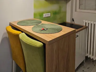 a kitchen with a counter with two plates on it at Apartment Ivon in Belgrade