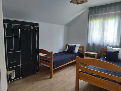 a small room with two beds and a window at LB boka 216 in Mali Mokri Lug