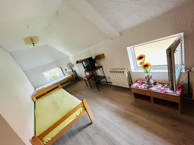 a room with a bed and a desk with a mirror at Rooms for rent 