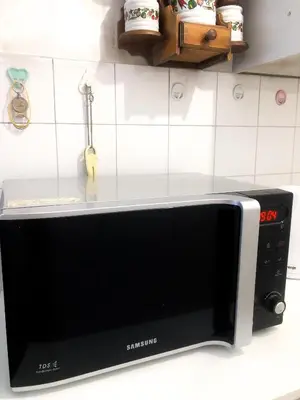a microwave oven sitting on a kitchen counter at Maki NBG in Belgrade