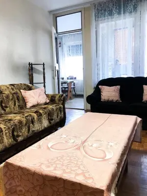 a living room with a couch and a table at Maki NBG in Belgrade