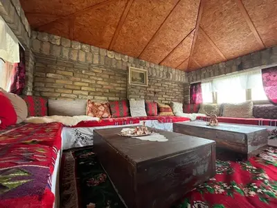 a living room with a couch and a table at R&H apartmani in Slankamenački Vinogradi