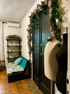 a room with a black door with flowers on it at Creative Apartment Kaleidoscope in Belgrade