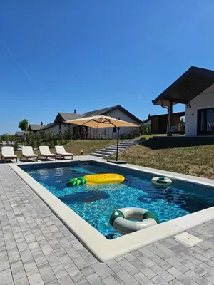 a swimming pool with several inflatable objects in it at K42 pool house in Vlasi
