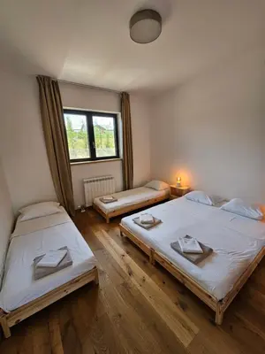 a room with two beds and a window at K42 pool house in Vlasi