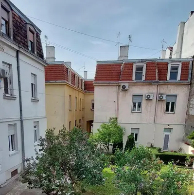 a group of buildings with trees in the middle at Apartment Roosevelt in Belgrade
