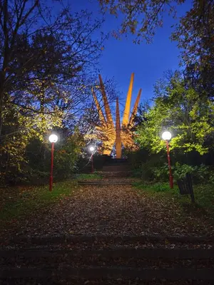 a park at night with two street lights at Košutica Vila in Koraćica