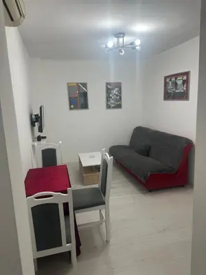 a living room with a couch and a table at STAN Beograd in Belgrade