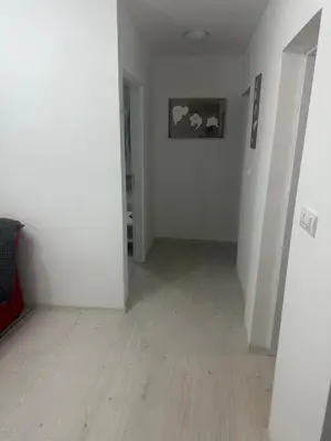an empty room with white walls and a wooden floor at STAN Beograd in Belgrade