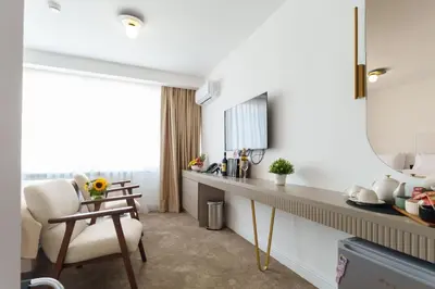 a room with a desk and a chair and a mirror at Move In Apartments - ApartHotel Belgrade in Belgrade