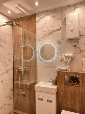 a bathroom with a shower and a sink at 5 star apartment in Novi Grad