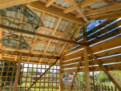 a large wooden ceiling with windows in a building at Danube Oasis Stevantown 3 in Stari Banovci