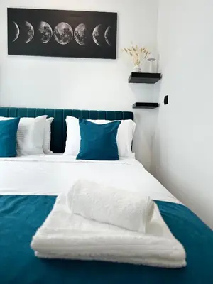 a bedroom with two beds with blue and white at Banovo Brdo Premium in Čukarica