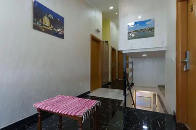 a hallway with a pink bench in a building at Step rooms apt spa in Belgrade