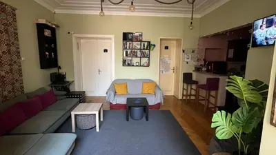 a living room with a bed and a couch at HostelChe Hostel in Belgrade