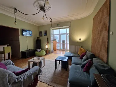 a living room with a couch and a tv at HostelChe Hostel in Belgrade