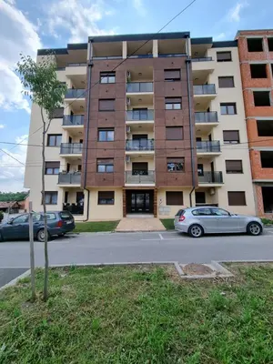 a building with two cars parked in front of it at The nest 31 in Irig