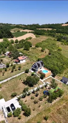 an aerial view of a house and a yard with a pool at Panorama Kosmaj in Sopot