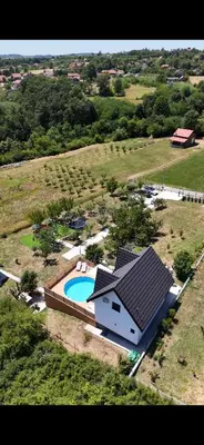 an aerial view of a house with a swimming pool at Panorama Kosmaj in Sopot