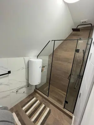 a bathroom with a shower and a toilet at Panorama Kosmaj in Sopot
