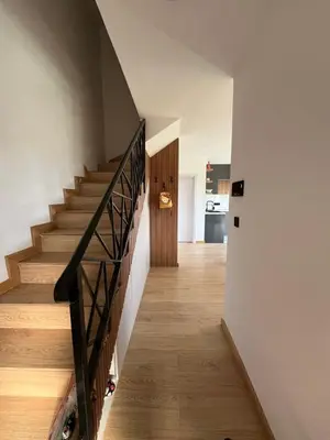 a hallway with stairs in a house at Panorama Kosmaj in Sopot