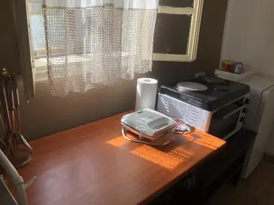 a desk with a toaster and a printer on it at Cica Vintage Eco House Near Lake in Crkvine