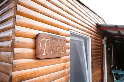 a sign on the side of a wooden building at Seosko turističko domaćinstvo Tisa i Begej in Kni°anin