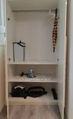 a white cabinet with some items in it at Studio Lara in Voždovac
