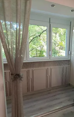 a room with two windows and a curtain at Studio Lara in Voždovac