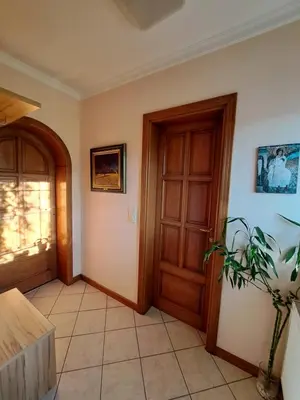 a hallway with a door and a plant in a room at Ramonda house in Brestovik