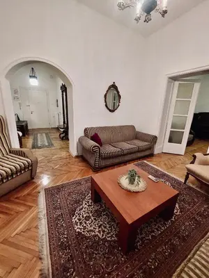 a living room with a couch and a coffee table at Sweet House Kalemegdan in Belgrade