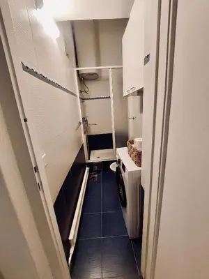 a small bathroom with a washing machine in it at Sweet House Kalemegdan in Belgrade