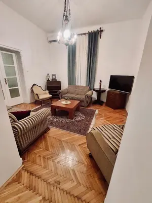 a living room with a couch and a table at Sweet House Kalemegdan in Belgrade