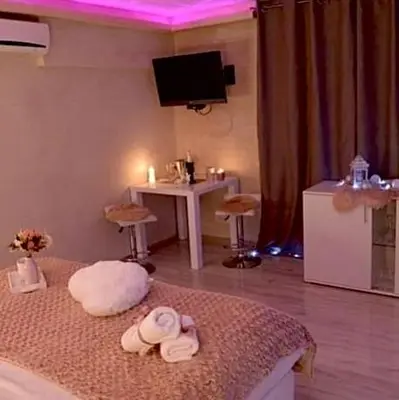 a room with a bed with two towels on it at Leona apartment in Zemun