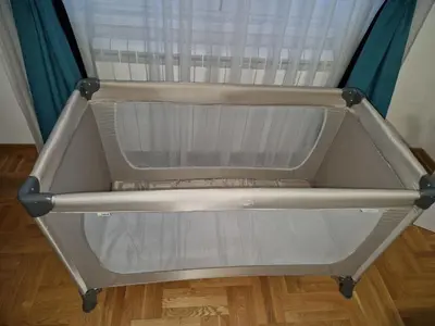 a bed frame with a window in a room at Plavi Paun Apartman in Belgrade