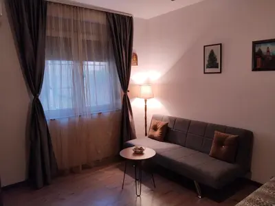 a living room with a couch and a table at Magistar in Zemun