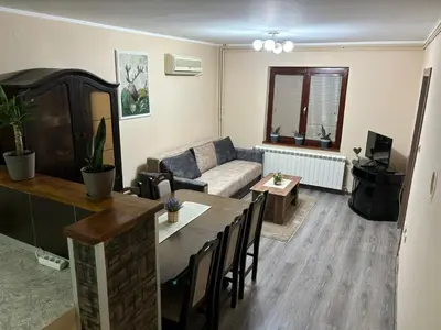 a living room with a couch and a table at Icy Apartment in Belgrade