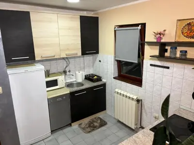 a small kitchen with a sink and a microwave at Icy Apartment in Belgrade
